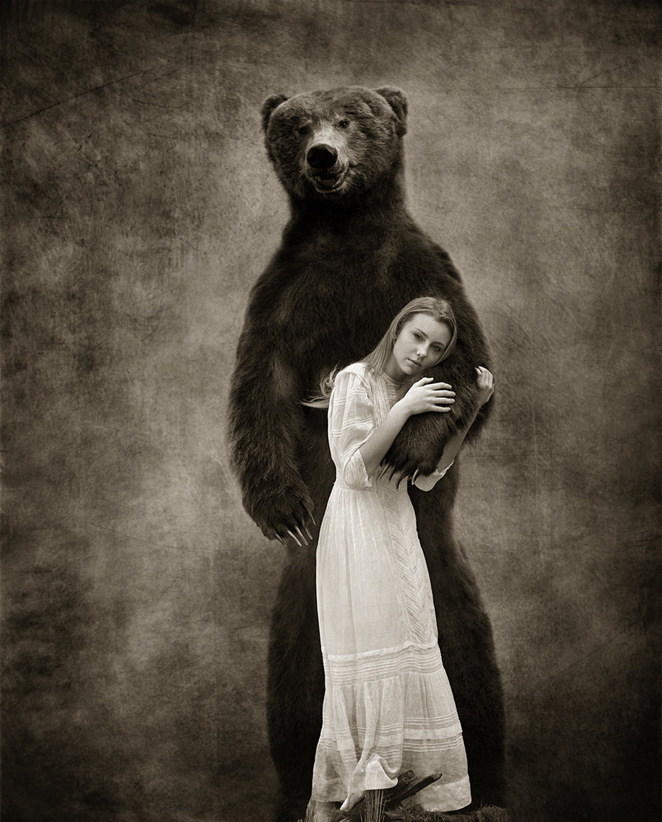 girl in the embrace of a giant wild grizzly bear