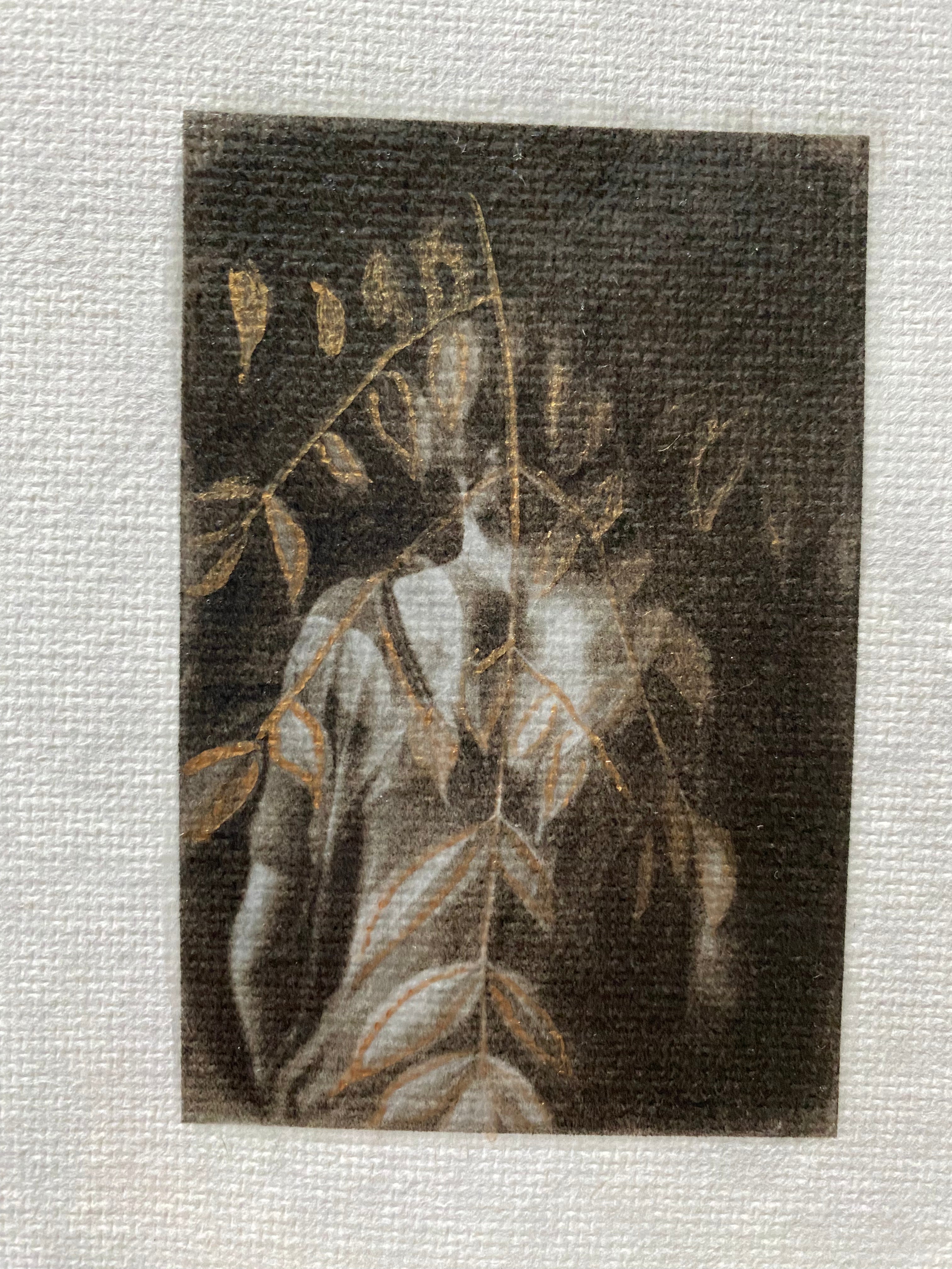 girl merged with leaves and hand painted with gold