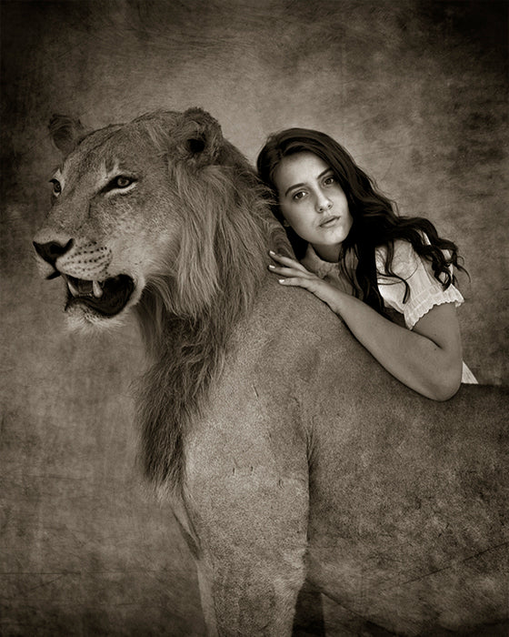 girl laying on wild lion