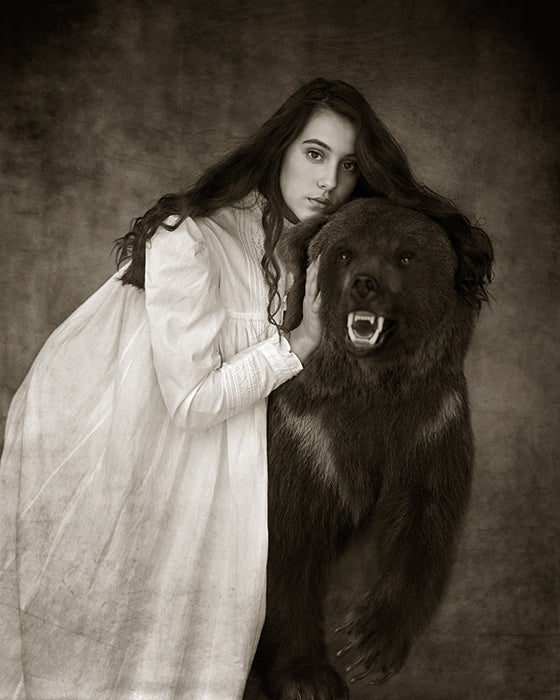 girl hugging a wild bear