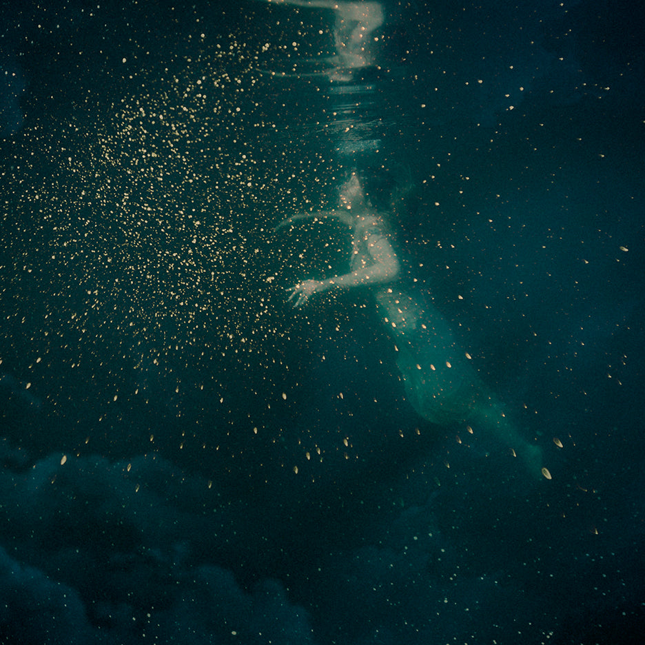 An ethereal image featuring a figure in a starry night sky with a backdrop of stars and cosmic dust.