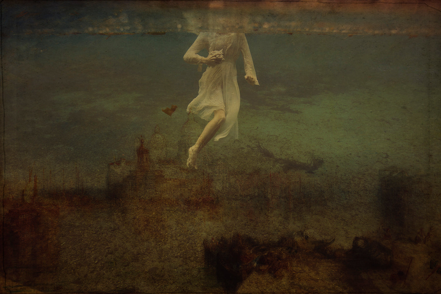 An ethereal photograph of a figure in a white dress underwater, surrounded by whimsical floral and forest-like elements, rendered in sepia and gold tones.