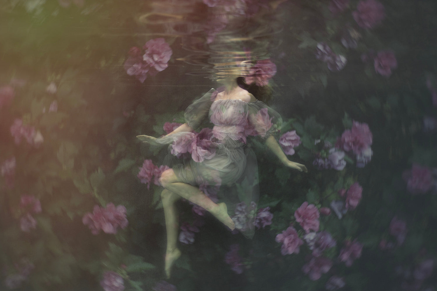 A digital artwork depicting a figure with floral elements, floating in an underwater setting with vibrant floral blooms around.