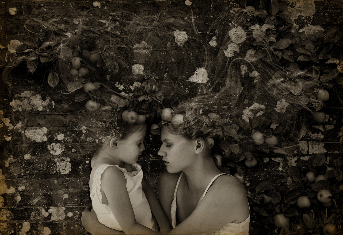A black and white photograph of two individuals embracing, set against a background with floral elements.