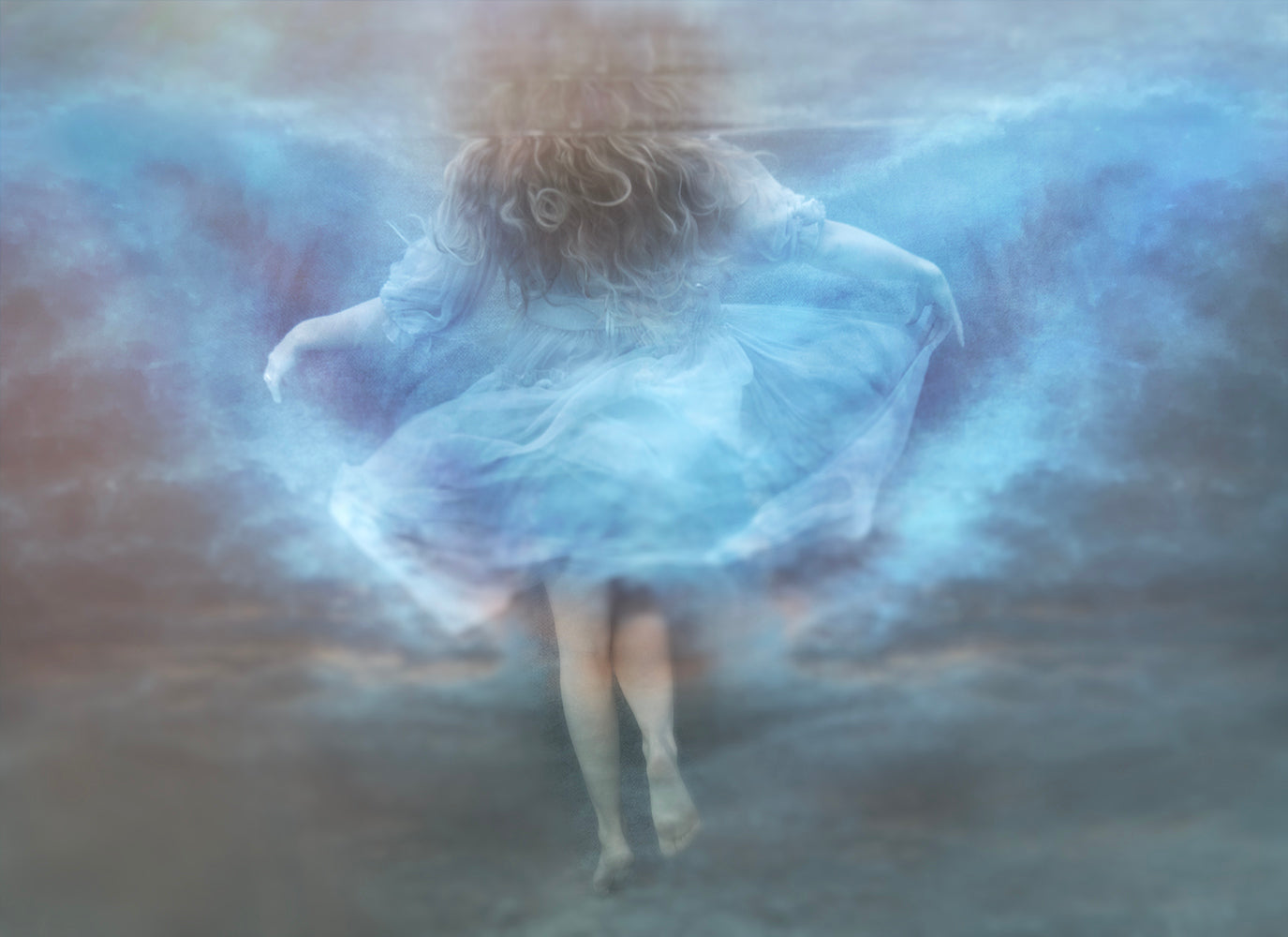 A whimsical photo of a person with butterfly wings, superimposed over a misty underwater scene with vibrant floral elements.